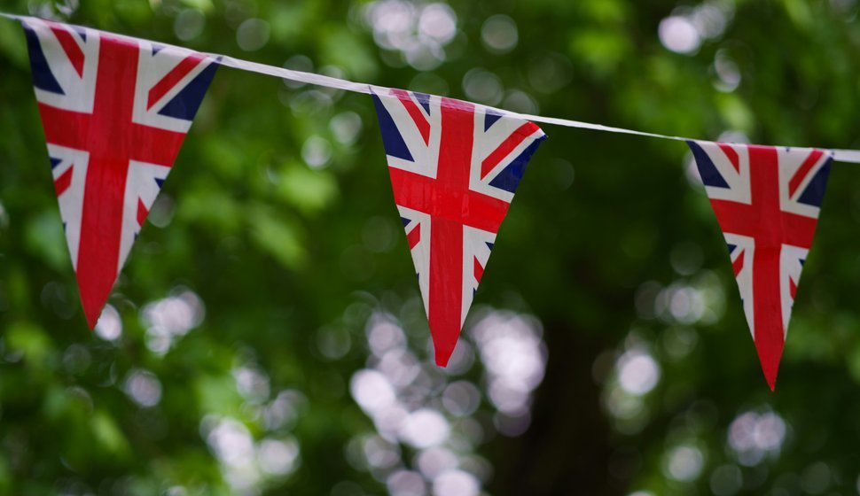 British flag bunting on a tree line
