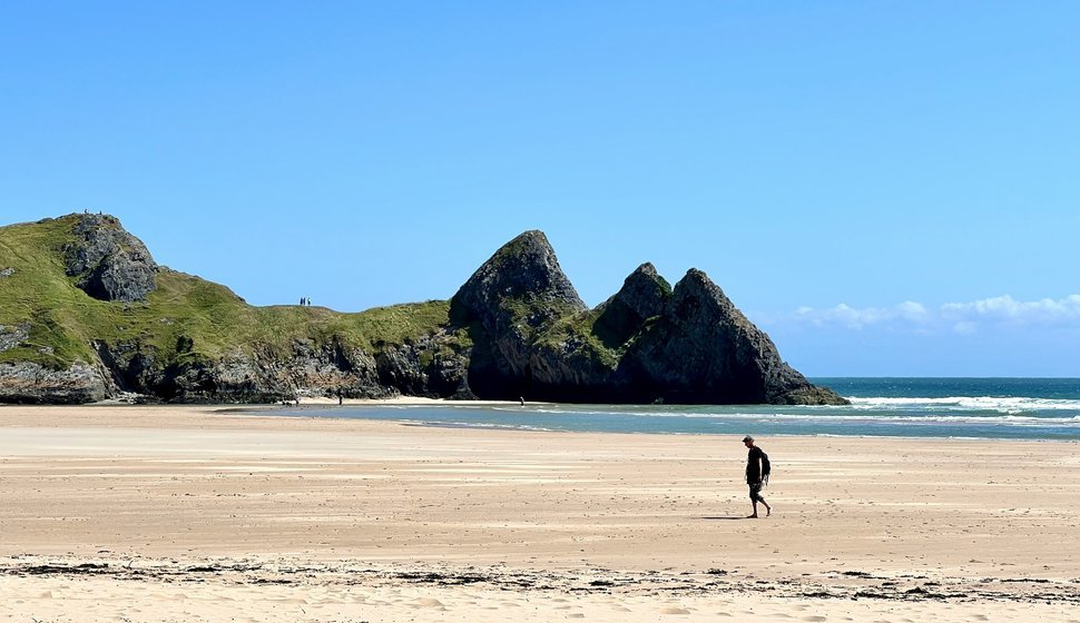 Walking on the beach of Three Cliffs Bay, Swansea